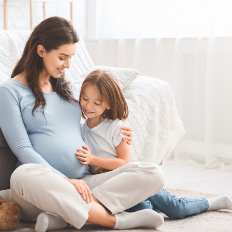 Family,Concept.,Adorable,Little,Girl,Cuddling,With,Her,Expecting,Mother
