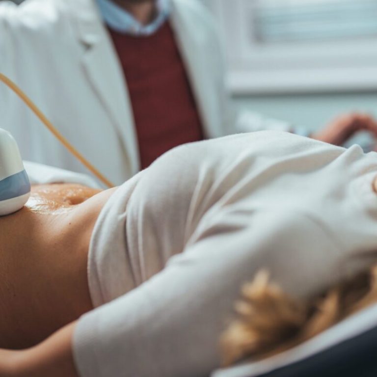 Mid,Adult,Male,Doctor,Using,Ultrasound,Scanner.,Ultrasound,Exam.,Doctor's